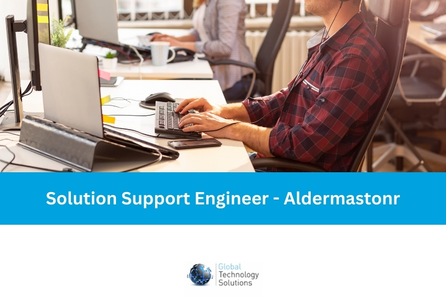 Solution Support Engineer working at a desk