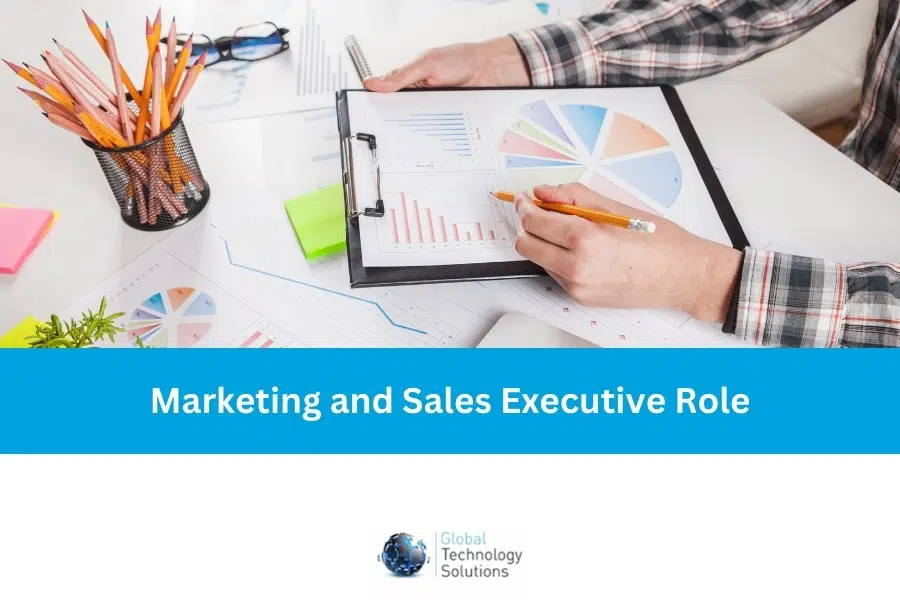 Sales and Marketing Executive working at a desk